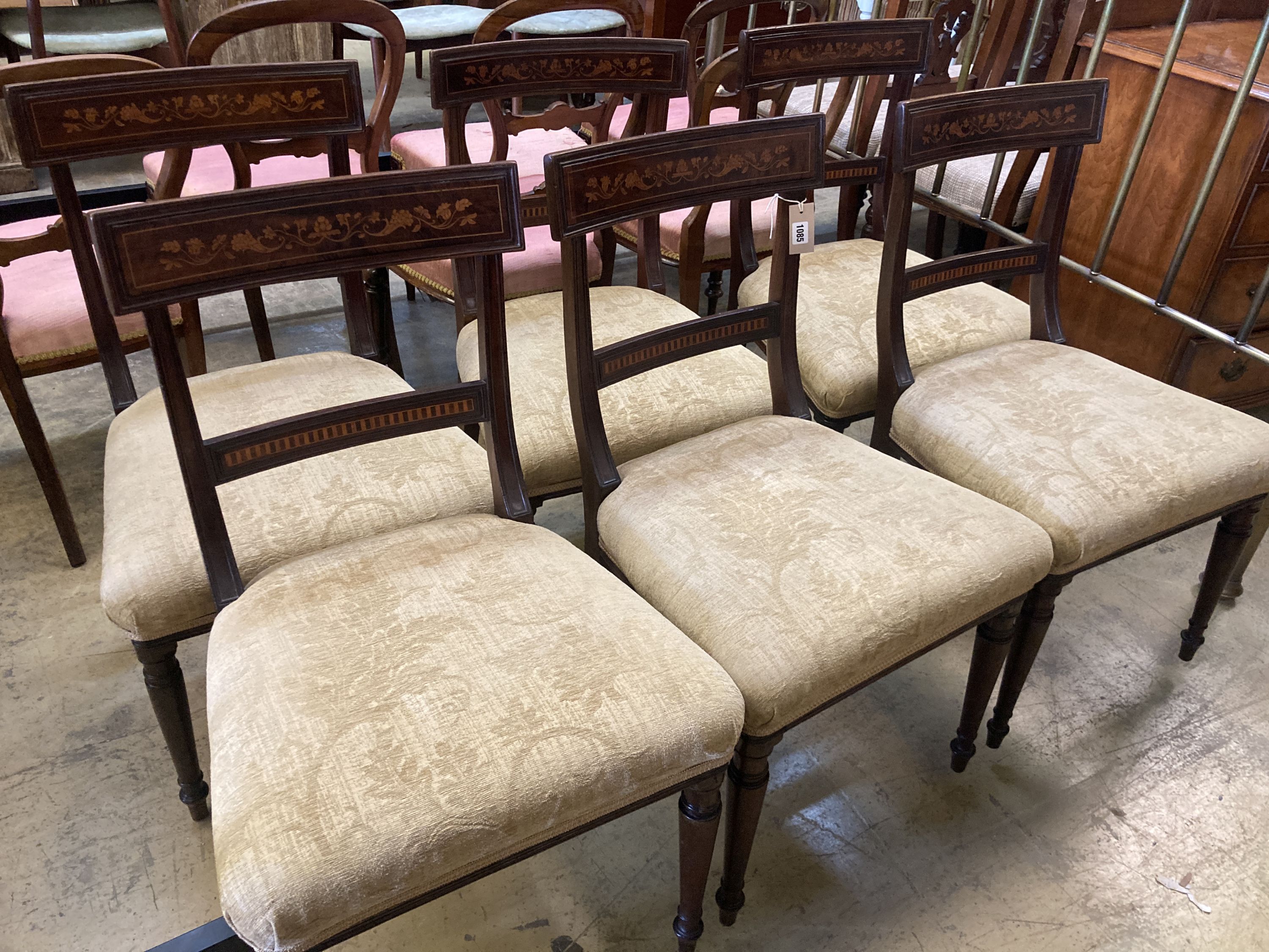 A set of six 19th century Dutch marquetry inlaid mahogany dining chairs